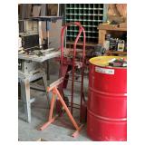 Red Hand Truck and Orange Material Roller Stand