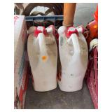 Two Large Plastic Jugs with Red Caps