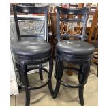 (2) Swiveling Bar Stools.