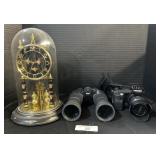 Nikon Binoculars, Minolta Camera, Clock.