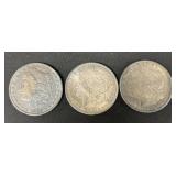 3 Morgan Silver Dollars- 1880-O, 1883-O, 1921-D.