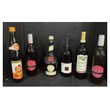 6 Liquor Bottles.