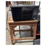Primitive Stool and Microwave.