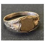 Gold Toned Marked Ring.