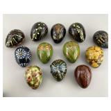 Twelve Lester Breininger Decorated Redware Eggs.