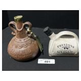 2 Sealed Liquor Decanters.