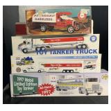 3 gas toy tanker trucks in box and 1 Race team
