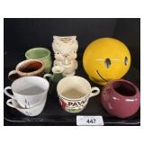 Various Mugs, Smiley Coin Bank, Bird Planter.