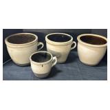 4 Stoneware Crocks.