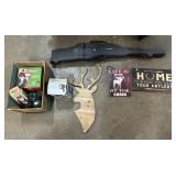 Rifle Case, Coleman Heater, Spotlight, Signs.