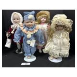 4 Beautiful Porcelain Collectible Dolls. 4 Beautiful Porcelain Collectible Dolls.