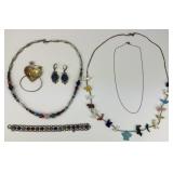 Sterling, Carved, and Beaded Navajo Jewelry.