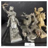 3 Cast Iron Statues.