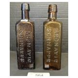 Ground Pontil Amber Glass Taper Top Bottles.