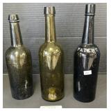 Green & Amber Ground Pontil Blown Glass Bottles.