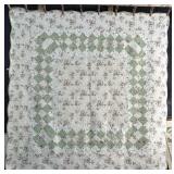 Floral Machine Sewn Patchwork Quilt.