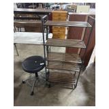 Four Tier Shelving Unit & Black Rolling Stool.