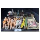 Empty Bottles, Opera Glasses, Plastic Dolls.