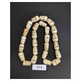 Carved Bone Skull Necklace.