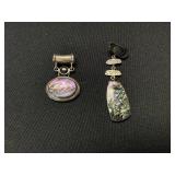 2 Sterling Silver Pendants.