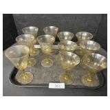 11 Amber Stemmed Glasses.