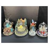 4 Disney Snowglobes.