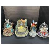4 Disney Snowglobes.