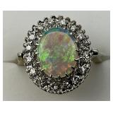 14KT White Gold Opal & Diamond Halo Ring.