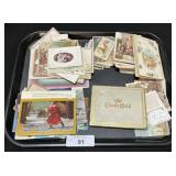 Religious Prints, Photo Postcards, Cigarette Tin.