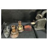 Oil Lamp Projector, Sad Iron, Candlestick Holders.