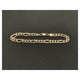 14 KT Gold Figaro Chain Bracelet.
