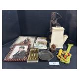 Carved Figure, Hunting Licenses, Cast Iron Pan.