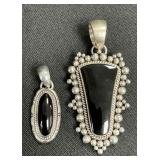 2 Sterling Silver Onyx Pendants.