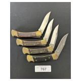 4 Buck 110 Wooden Handle Pocket Knives.