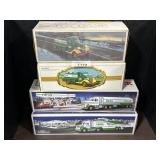 4 Hess Trucks w/ Boxes.