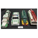 4 Vintage Hess Trucks.
