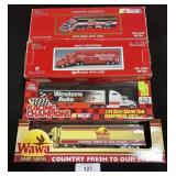 3 Racing Champions & 1 Wawa Trucks & Trailers.