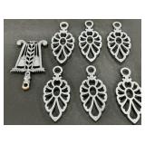 7 Cast Iron Trivets.