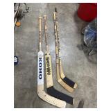 (4) Hockey Sticks.