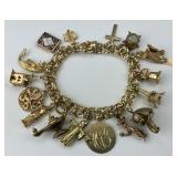 Heavy 14KT Gold 16 Charm Bracelet.