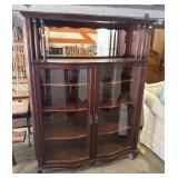 Ornate Serpent Front Curio Cabinet.