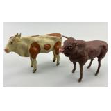 2 German Composition Stick Leg Bull Toys.