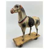 German Composition Stick Leg Pull Toy.