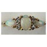 14KT Gold Opal & Diamond Chip Ring.