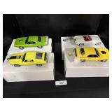 4 Danbury Mint Model Cars.