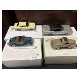 4 NOS Die Cast Collector Cars.