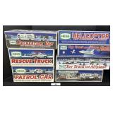 7 Various Hess Trucks, Patrol Car, RV, Helicopter.