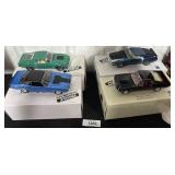 4 Danbury Mint Model Cars.