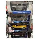 4 NOS Maisto Die Cast Cars.