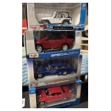 4 NOS Maisto Die Cast Cars.